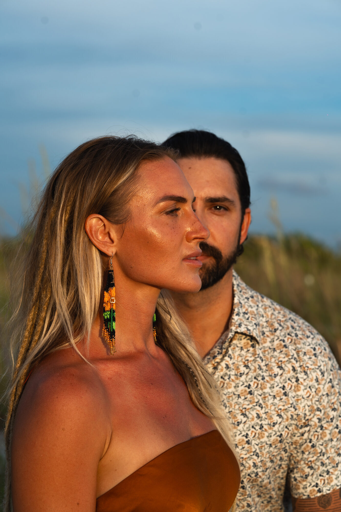 Close-up portrait of an engaged couple in golden light