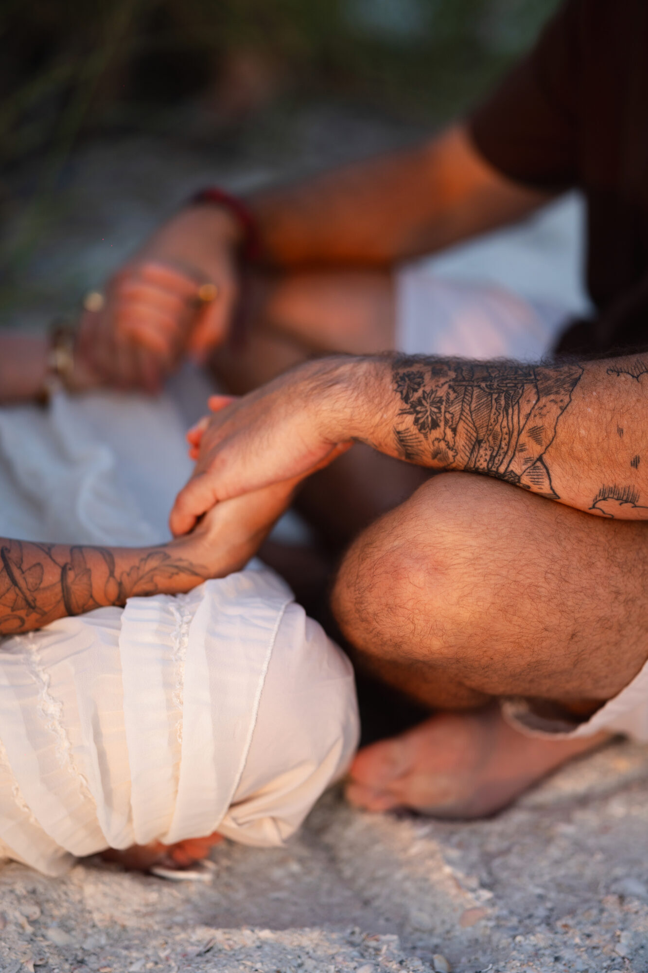 Engaged couple embracing during a sunset engagement session