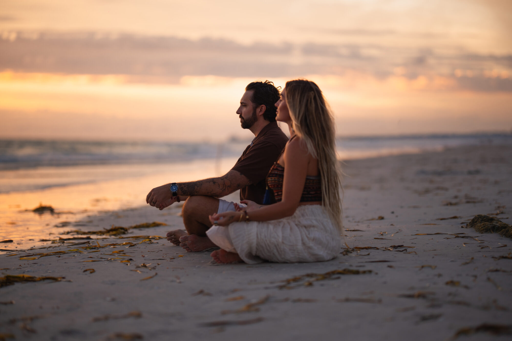 Couple laughing together during an outdoor engagement shoot