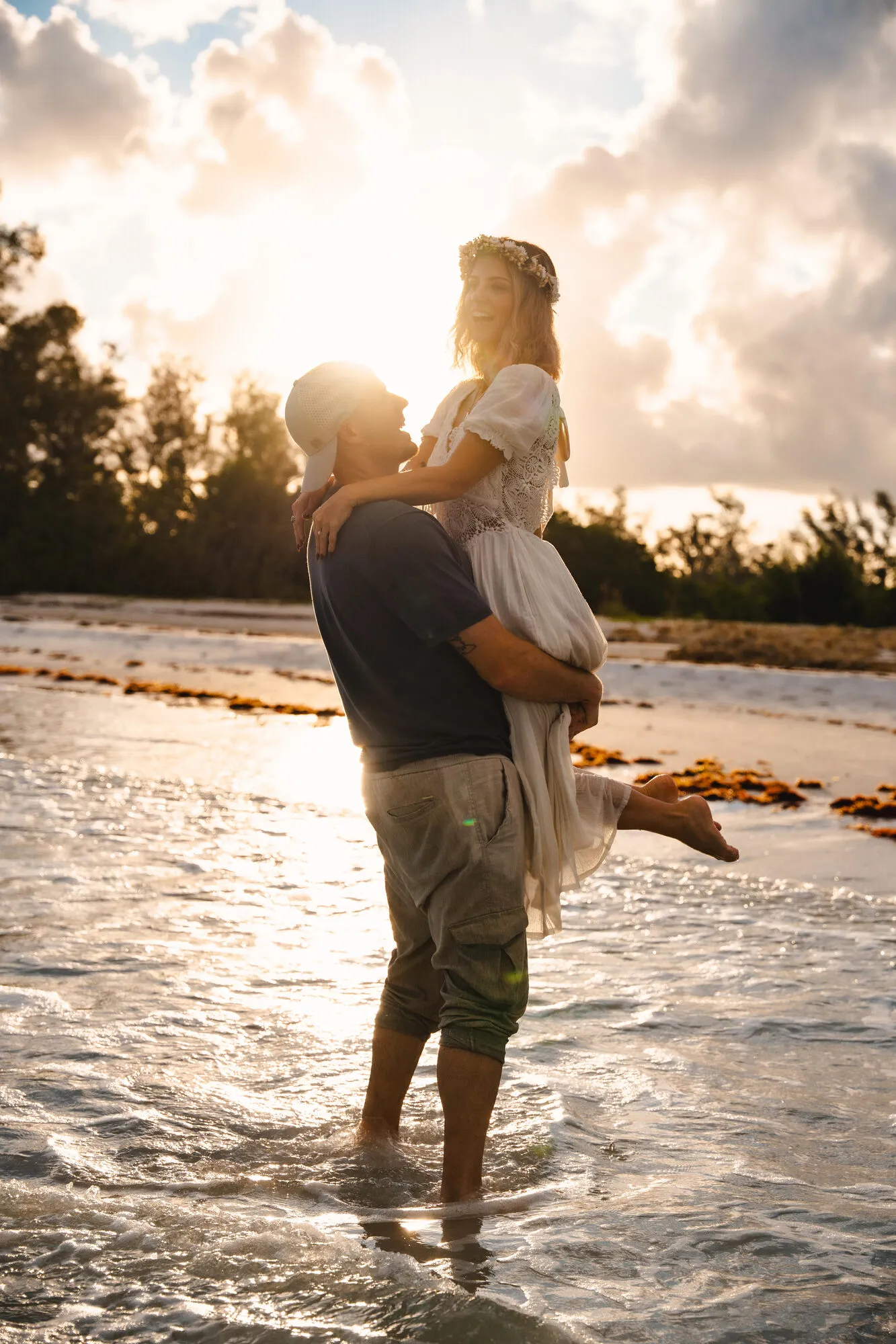 Bride and groom exchanging vows overlooking the ocean