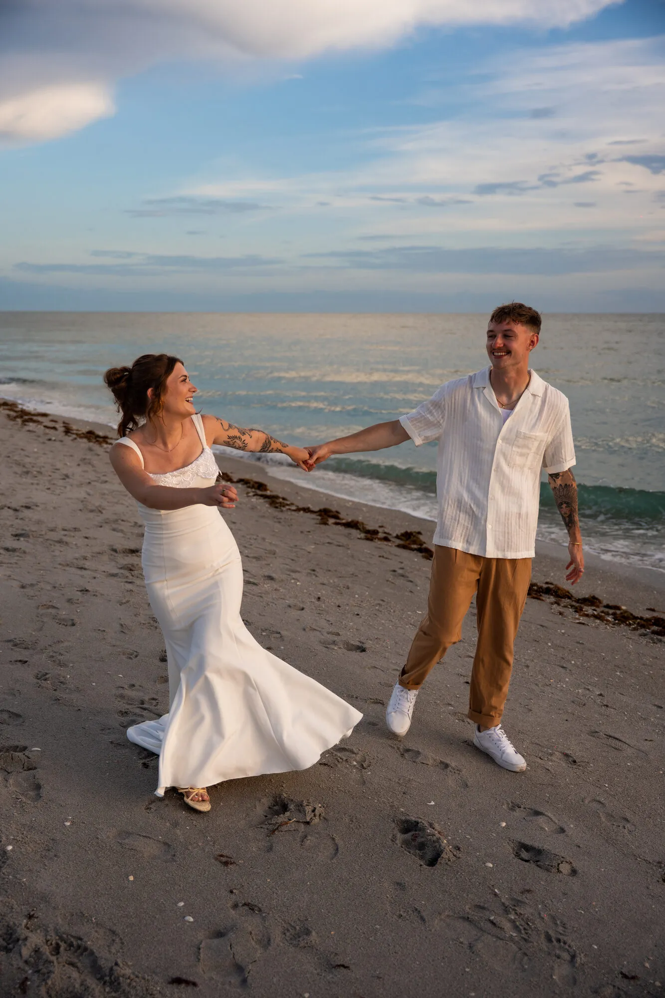 Bride and groom exchanging vows overlooking the ocean