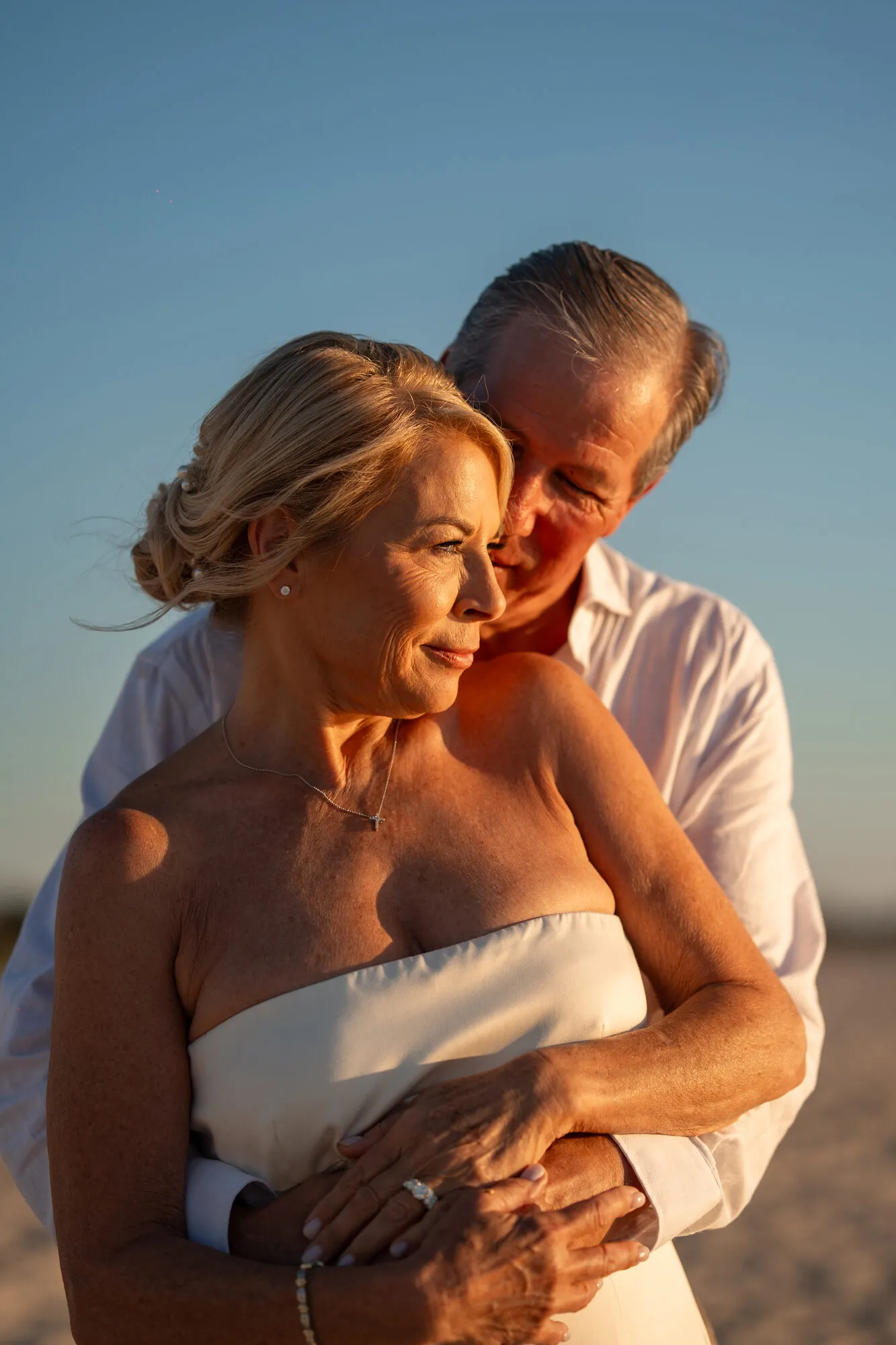 Bride and groom sharing an intimate moment during golden hour